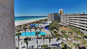 A hotel with a pool, beach view, and multiple floors. - Dunes of Panama #c503 (Panama City Beach)