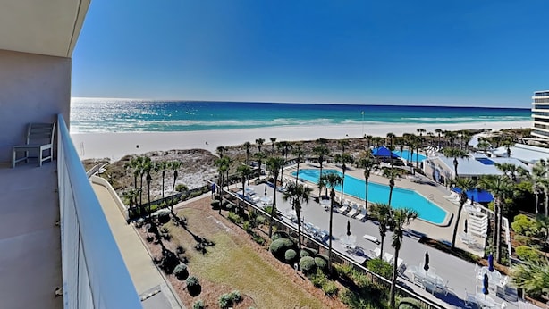 A resort with a pool, beach, and clear blue sky. - Dunes of Panama #c503 (Panama City Beach)