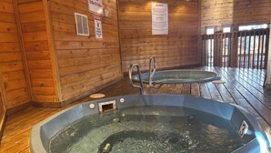 A wooden cabin with two hot tubs, wooden floors, and a sign indicating a 30-minute spa hour. - Ski~in~Ski~out~Tyra Aspen~2 Bd/2 Ba~Hot Tubs! (Breckenridge)