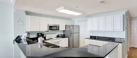 Coffee/tea maker, fridge, microwave, oven