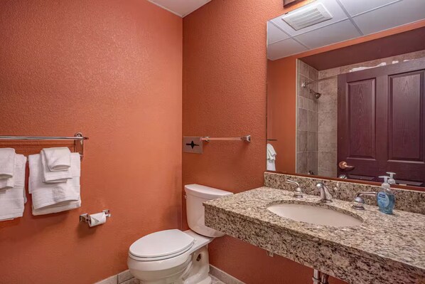 Shower, hair dryer, towels, toilet paper