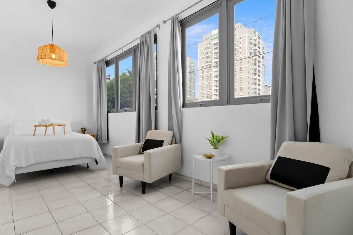 Wake up to natural light and a welcoming city view.