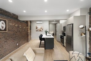 Deluxe Apartment, City View | Living area - The Griffin (Montréal)