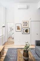 Comfort Apartment | Living area | 65-inch Smart TV with digital channels, Netflix, Hulu