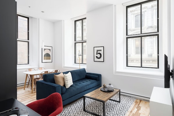 Premium Apartment | Living area | 65-inch Smart TV with digital channels, Netflix, Hulu