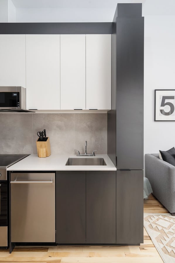 Exclusive Apartment | Living area | 65-inch Smart TV with digital channels, Netflix, Hulu - The Alexander Hotel - Old Montreal (Montréal)