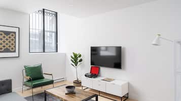Apartamento design | Área de estar | Smart TV 65 polegadas com canais digitais, Netflix, Hulu