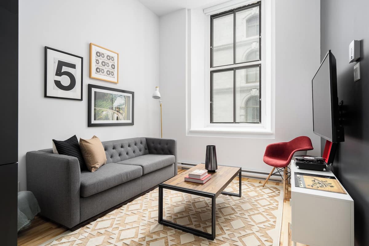 Exclusive Apartment | Living area | 65-inch Smart TV with digital channels, Netflix, Hulu