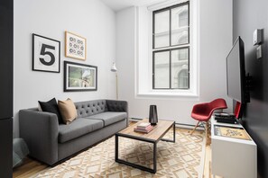 Exclusive Apartment | Living area | 65-inch Smart TV with digital channels, Netflix, Hulu - The Alexander Hotel - Old Montreal (Montréal)