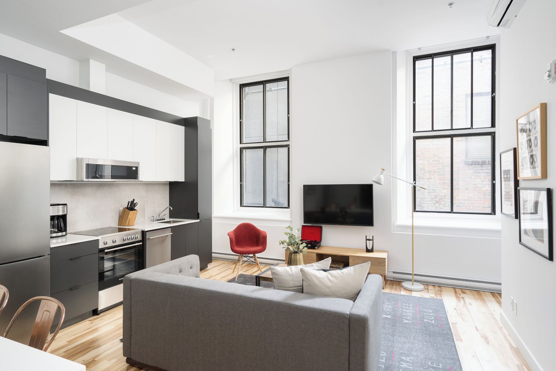 Comfort Apartment | Living area | 65-inch Smart TV with digital channels, Netflix, Hulu