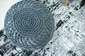A round, textured object with a complex pattern, placed on a patterned surface. - Port city-german colony 2 bdrms w/balcony+mamad 1 (Haifa)