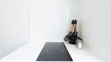 Coffee/tea maker, fridge, microwave, dining tables