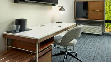 Premium bedding, desk, laptop workspace, blackout curtains