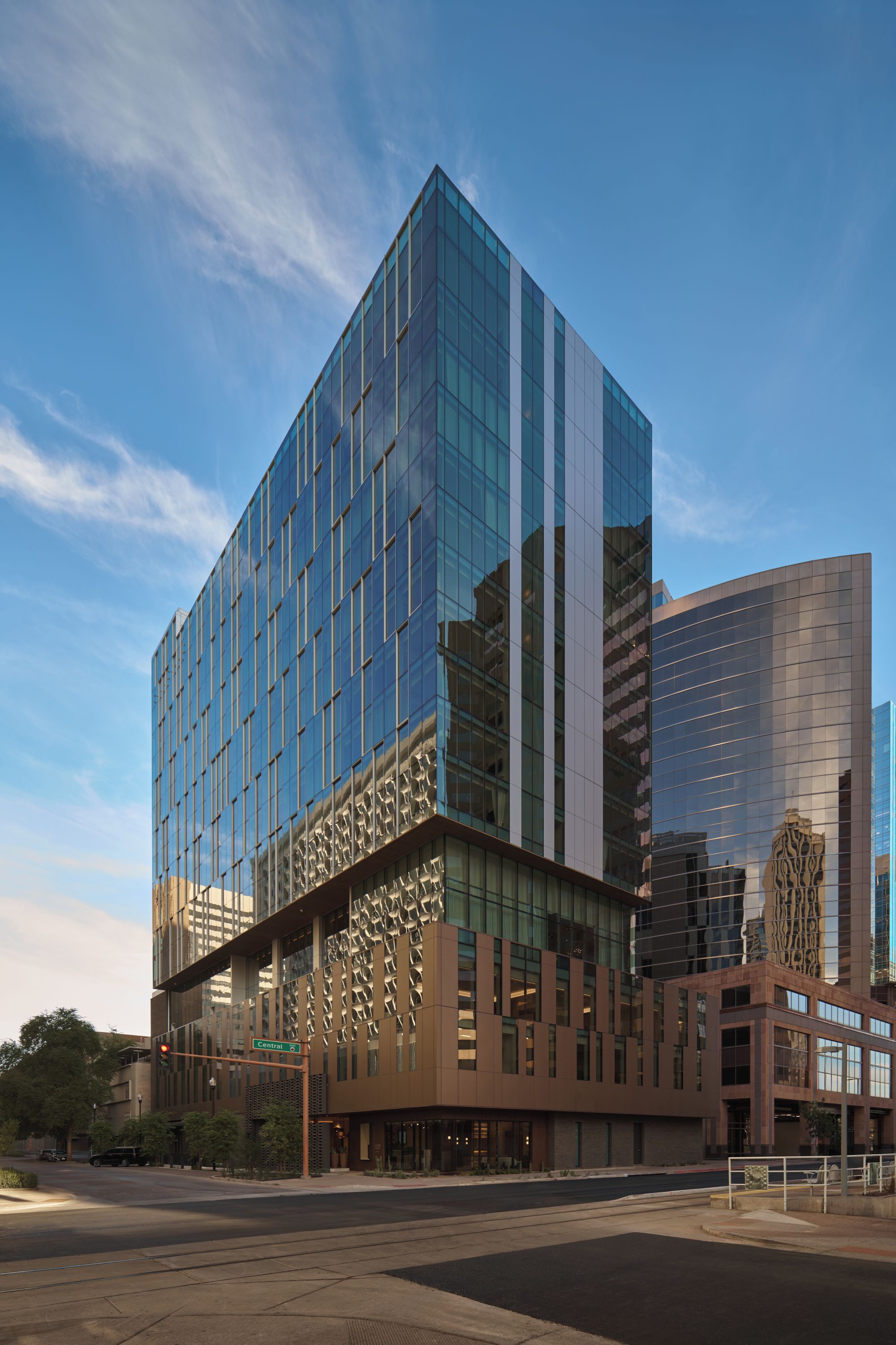 A modern building with a glass facade and a unique architectural design.