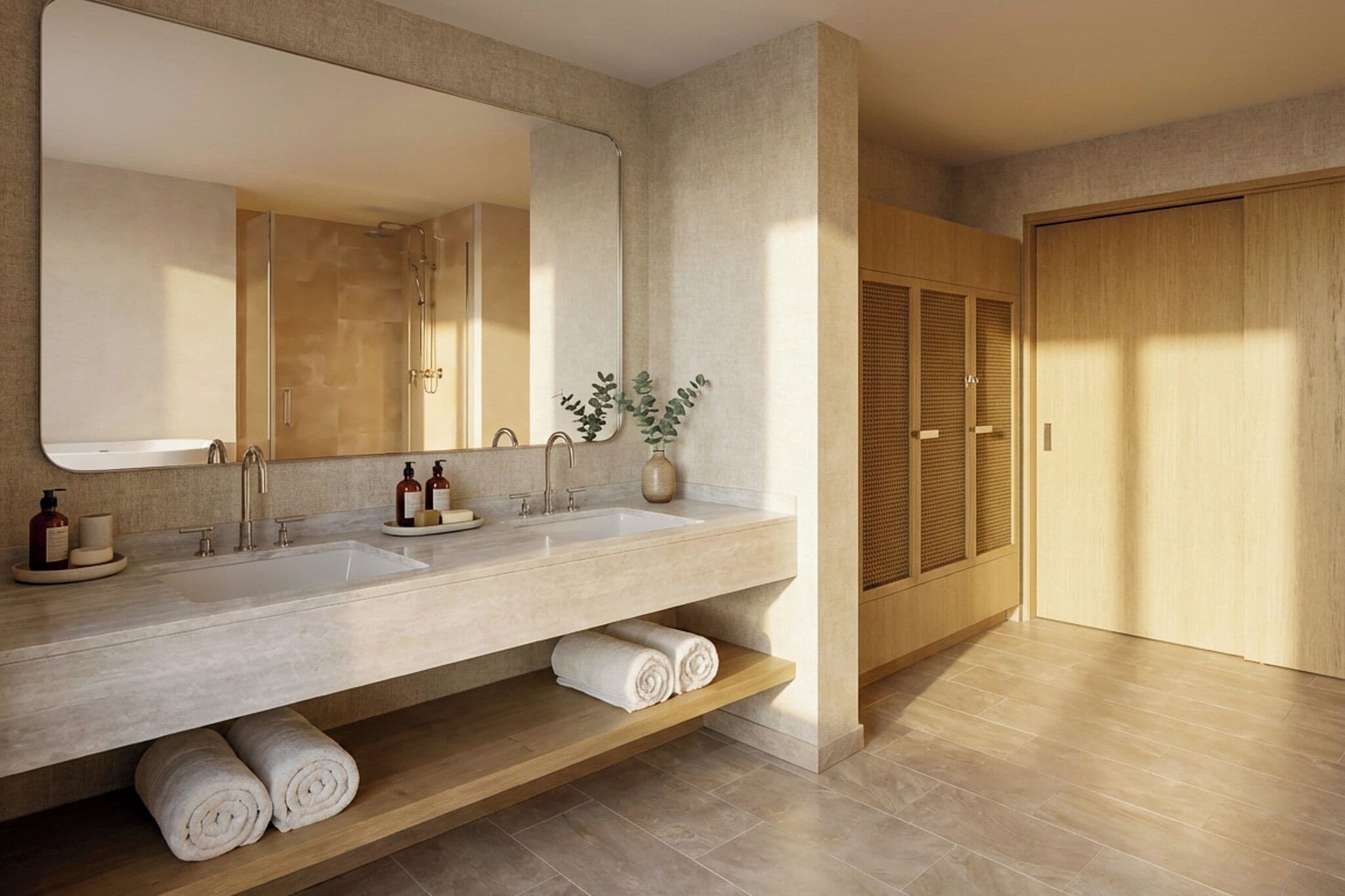 A modern bathroom with a large mirror, two sinks, a shower, and a wooden cabinet.