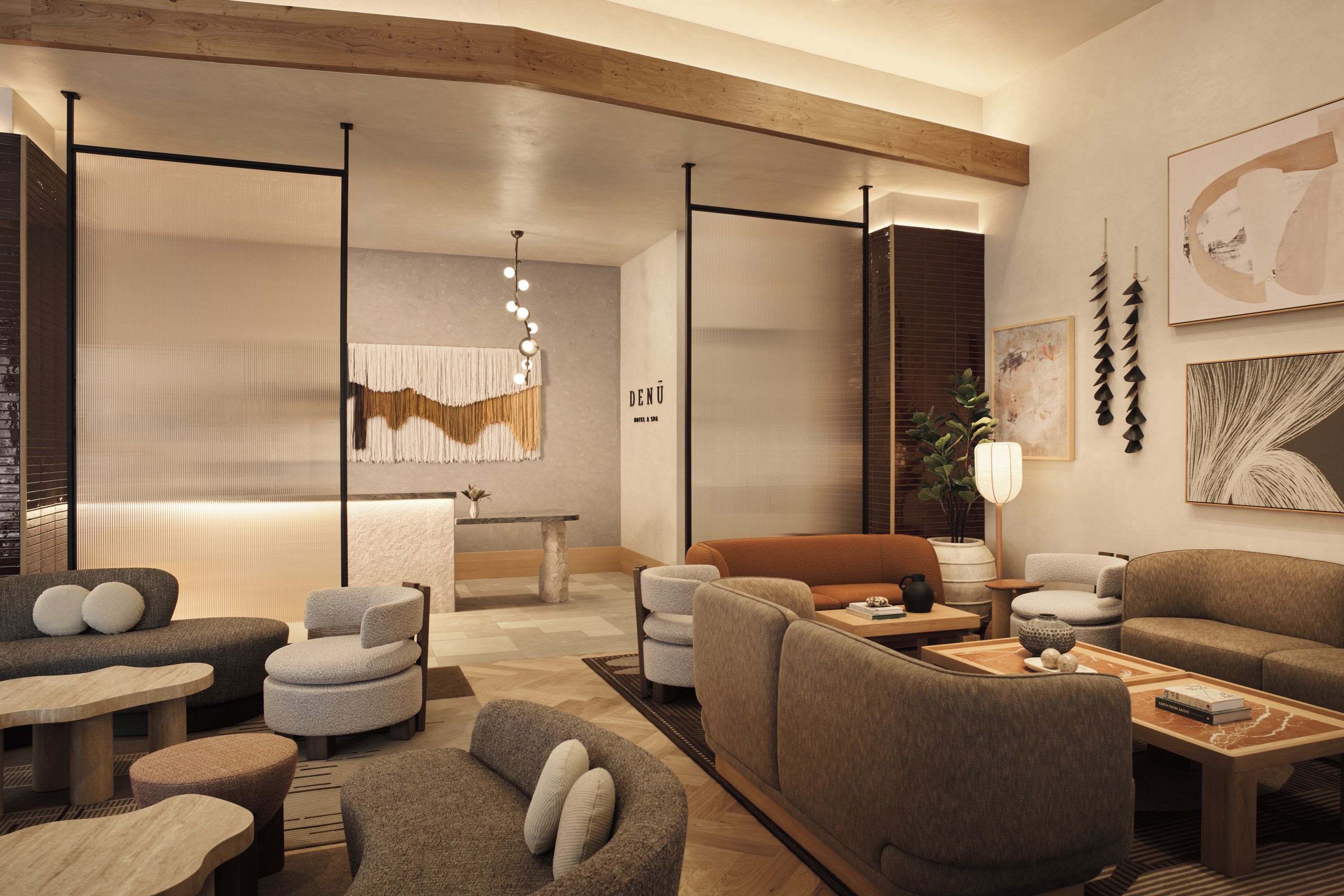 A modern hotel lobby with a seating area, a reception desk, and a large window.