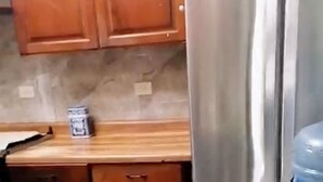 A kitchen with wooden cabinets, a stainless steel refrigerator, and a water dispenser. - Charming 3-bedroom house. located in San Jose Casas Caidas Mpio La Barca. (San Jose Casas Caidas Mpio La Barca)