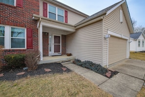 A two-story house with a brick facade and a beige siding exterior. - 3 Mi to Butler U: Family-Friendly Indy Home (Indianapolis)