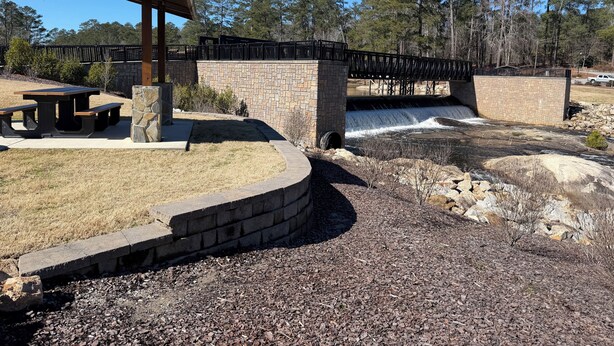 A picnic area with benches and a covered pavilion, a stone wall, a bridge, and a waterfall. - Stylish 3 BR home in Downtown Lexington (Lexington)