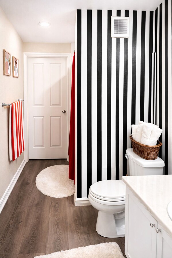 Shower, hair dryer, towels, toilet paper