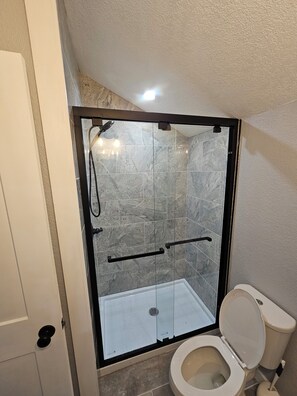 Shower, hair dryer, towels, soap