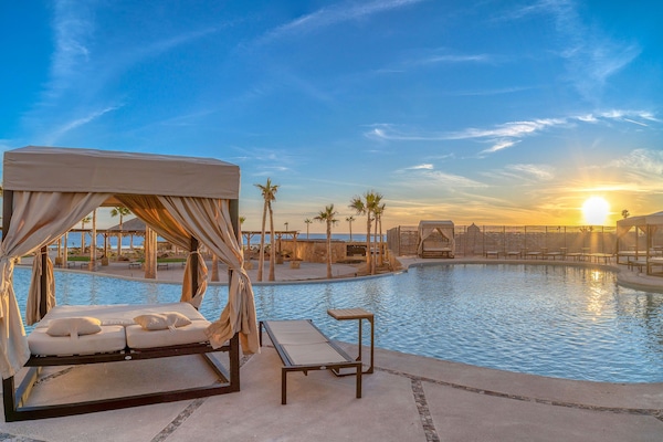 6 outdoor pools, open 8:00 AM to midnight, free cabanas, pool umbrellas
