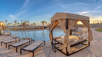 6 outdoor pools, open 8:00 AM to midnight, free cabanas, pool umbrellas
