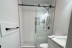 Shower, hair dryer, towels, soap