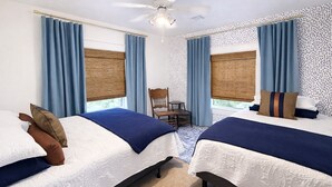 A hotel room with two beds, a ceiling fan, and a window with a view. - 12 miles to Ponca, Close to Kaw Lake & Casinos, Dog Friendly (Newkirk)