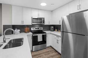 Microwave, oven, stovetop, dishwasher - Guest Suite in the SE| Near South Health Campus/Seton YMCA , Shopping &Amenities (Calgary)