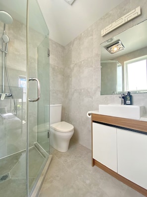 Shower, hair dryer, towels, soap
