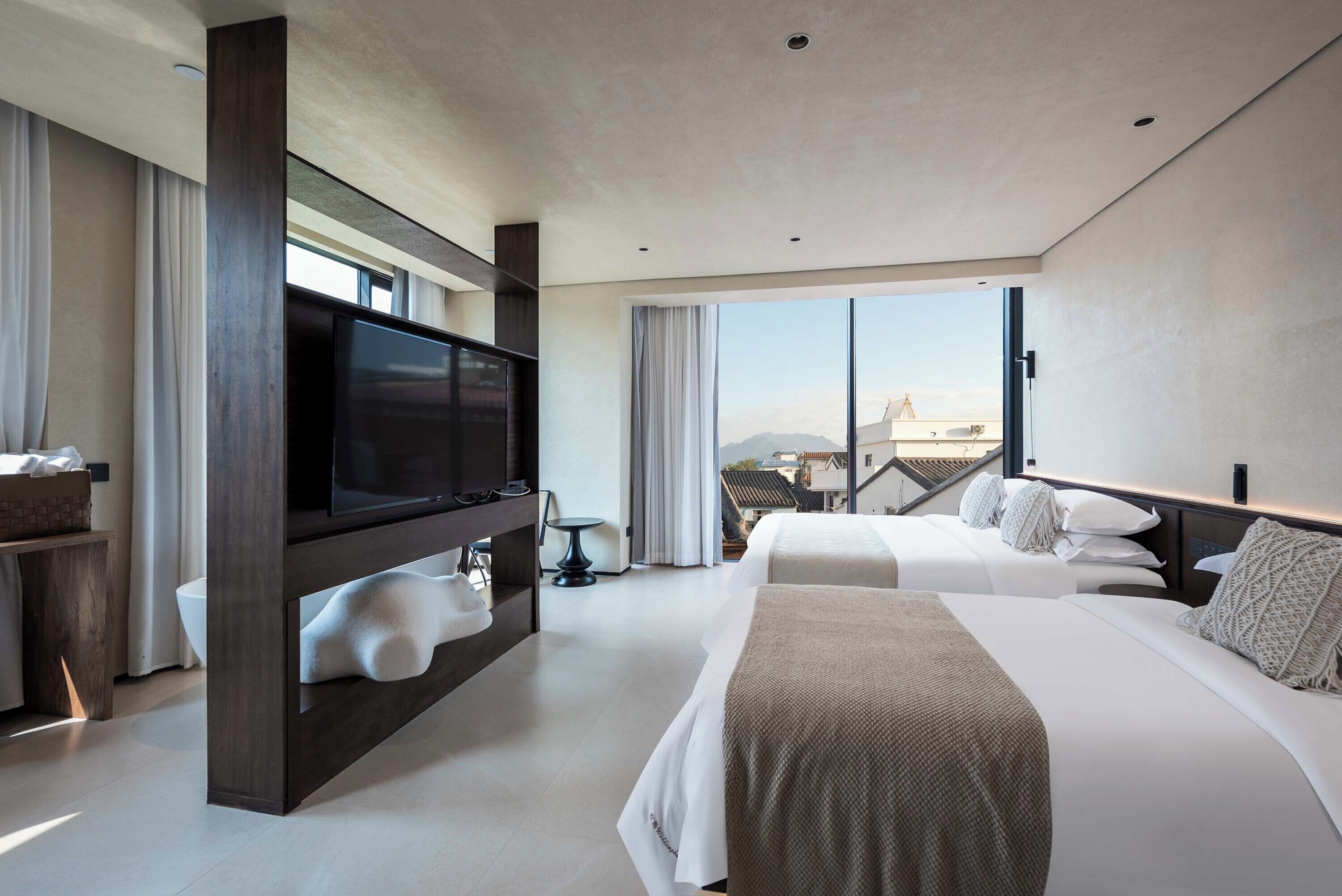 Habitación City con 2 camas individuales | Minibar con artículos gratuitos, escritorio, cortinas opacas