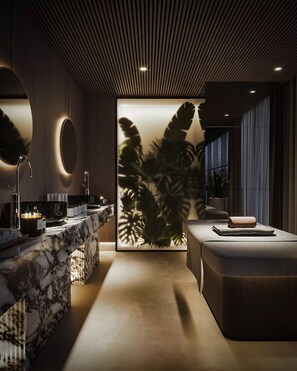 A modern bathroom with a marble vanity, a large mirror, and a wall-mounted sink. - Buddy Feely Hotel (Guangzhou)