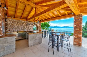 Outdoor dining - Holiday apartment with wellness facilities and shared swimming pool (Novi Vinodolski)