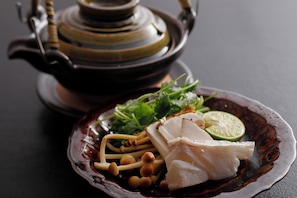 A plate of food with a teapot in the background. - Arima Hot Spring nebi (Kobe)