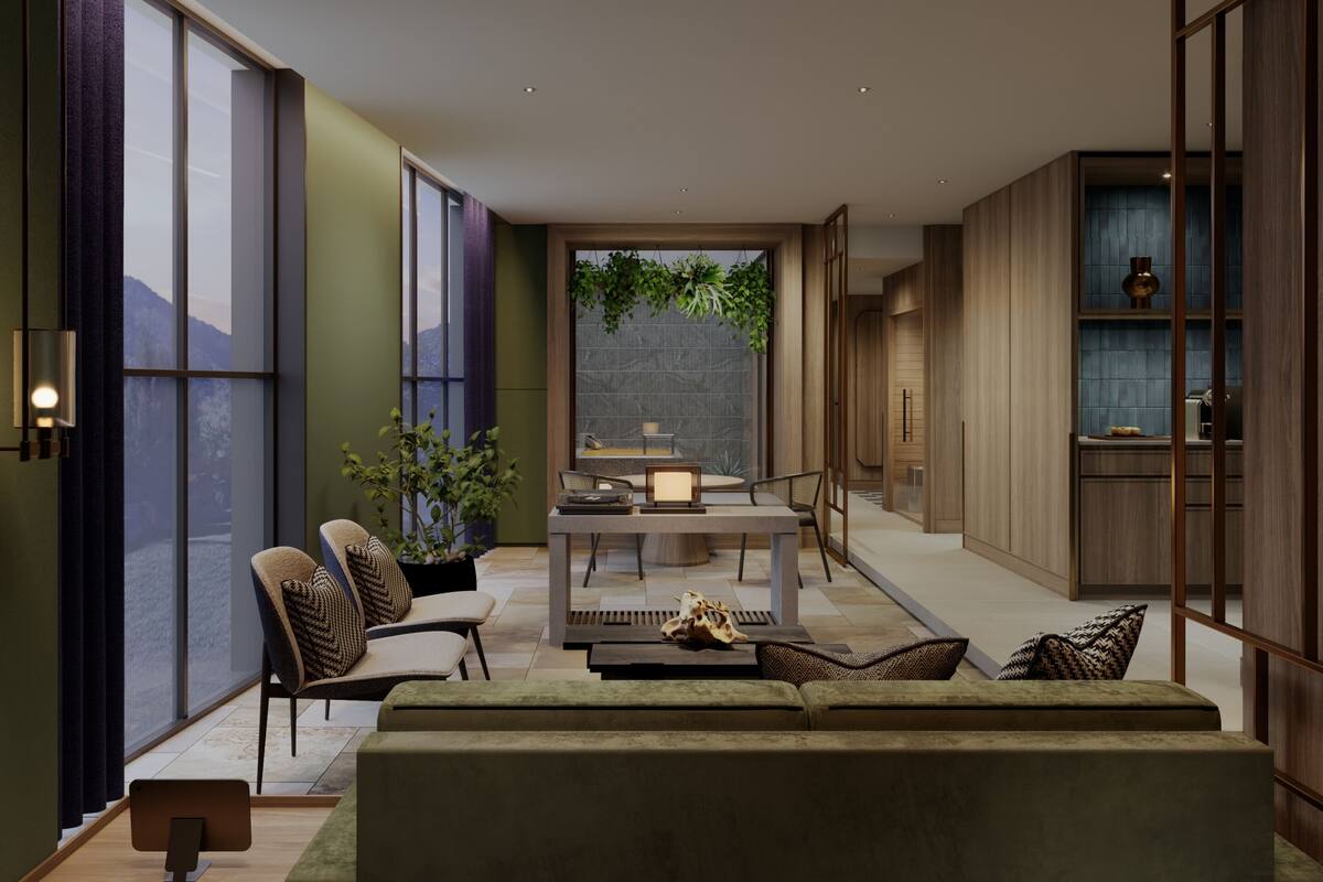 A modern living room with a sofa, chairs, a dining table, and a view of a mountain.