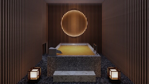 Ett modernt spa med en central bubbelpool, träpanel och två väggmonterade lampor.