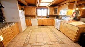 Fridge, microwave, oven, dishwasher - Rockin R Ranch - Authentic Log Lodge on 10 Acres with Wraparound Deck & Mountain Views Near M... (Garden City)