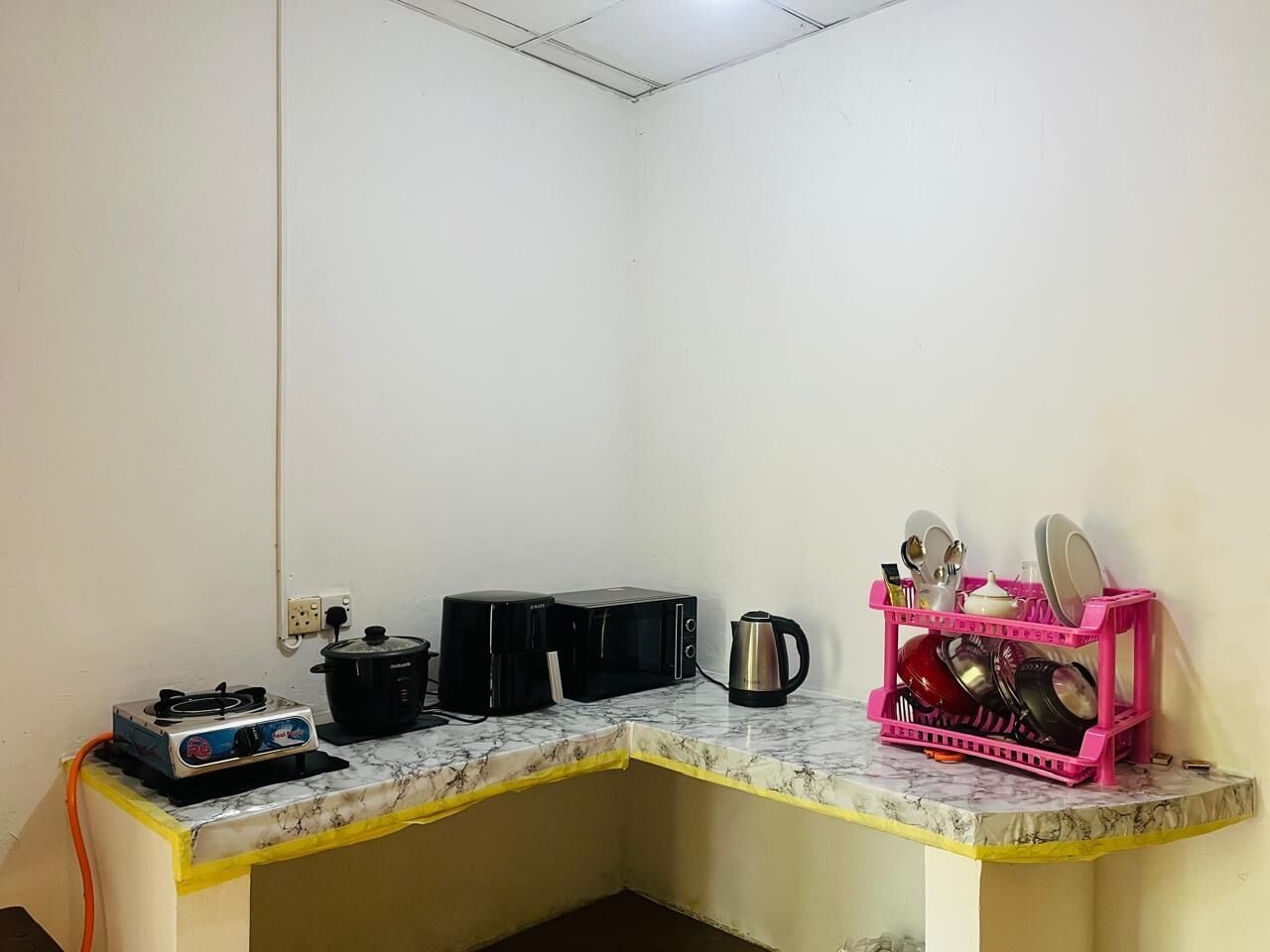 Microwave, cookware/dishes/utensils, cleaning supplies, paper towels