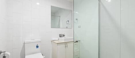 Shower, hair dryer, towels, shampoo