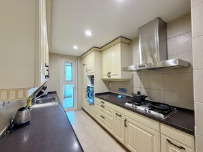 Superior Apartment, 2 Bedrooms, Balcony, City View | Private kitchen | Fridge, microwave, stovetop, cookware/dishes/utensils - Tyms Changning 2BR near Zhongshan Metro (Shanghai)