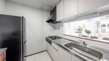 Apartment | Private kitchen | Fridge, microwave, stovetop, highchair