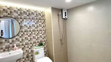 Shower, towels, soap, toilet paper