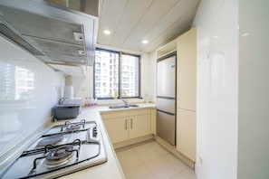 Fridge, microwave, stovetop, cookware/dishes/utensils - Tyms Gubei Apt 2BR Residence near Gubei (Changning District, Shanghai, China)