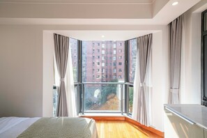 Superior Quadruple Room, Multiple Beds, Balcony, City View | Desk, laptop workspace, blackout curtains, soundproofing - Tyms Gubei Apt 2BR Residence near Gubei (Shanghai)