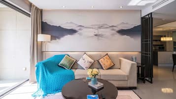 Apartamento superior, 3 quartos, sacada, vista para a cidade | Área de estar