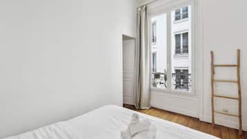 1 bedroom, desk, iron/ironing board, travel crib