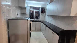 Fridge, microwave, oven, stovetop - Tulsi Luxury Home (Mumbai)