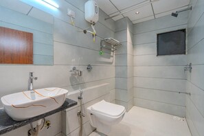 Deluxe Double Room | Bathroom | Shower, towels, soap, shampoo - Hotel TGR (Chikhli)