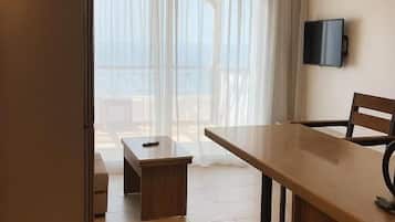 Senior Suite, Sea View | Living area | 34-inch Smart TV with cable channels